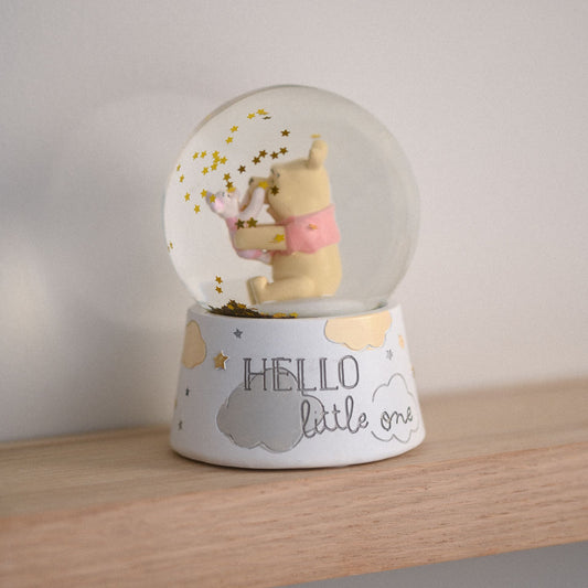 Disney Magical Beginnings Winnie The Pooh and Piglet Snow Globe. This irresistibly adorable globe is cast from a handmade clay mould, in which sits the adorable Pooh and Piglet embracing one another.