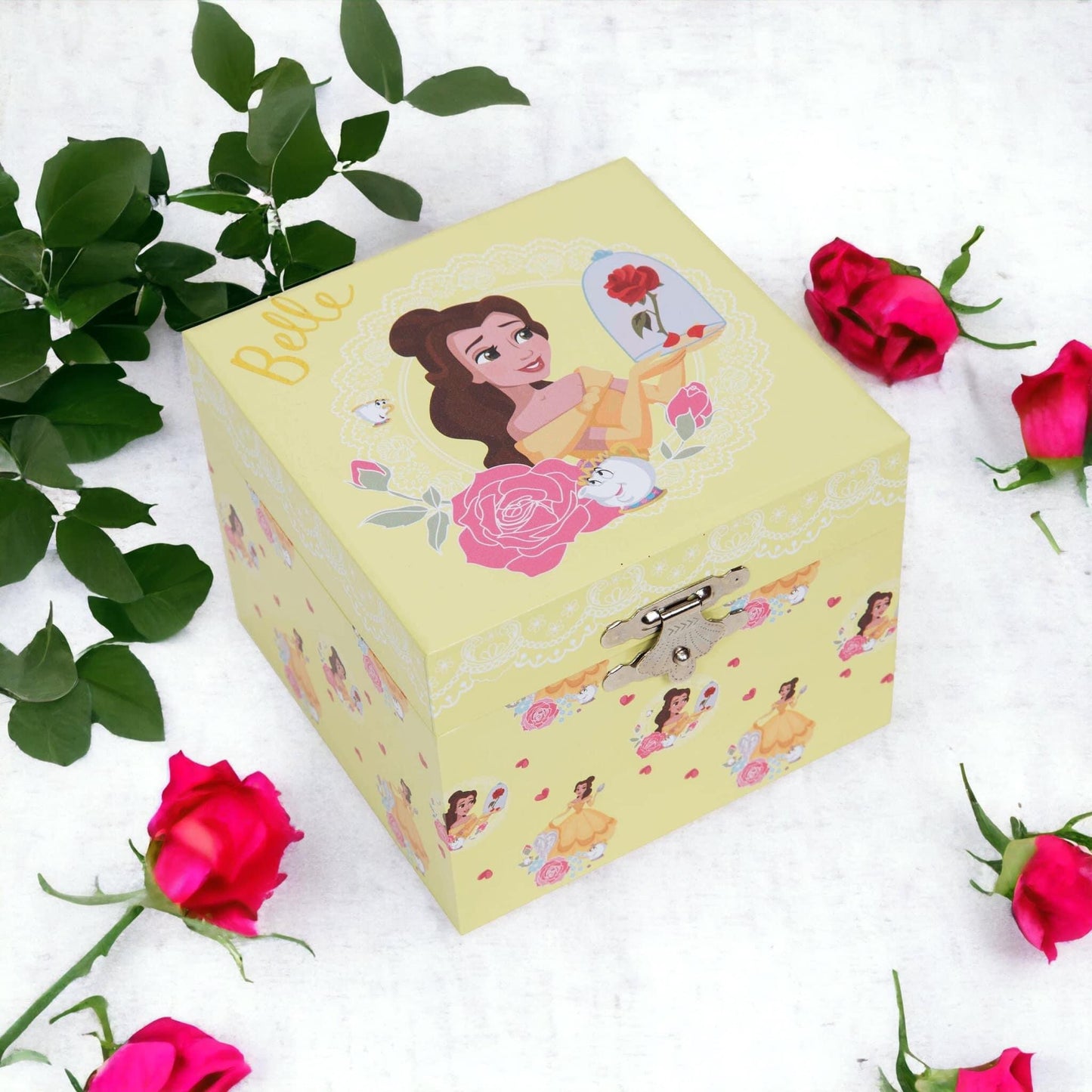 Princess Belle Musical Jewellery Box. 
Featuring:

Pastel yellow paper wrapped box with gold foil Belle title.
Beautiful Belle in her yellow ball gown illustration.
Wind up musical mechanism - plays "Fur Elise".
Rotating Belle plaque inside.
Oval shaped mirror under the lid.
1 x Large compartment.
Silver shell shaped push clasp.
